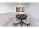 Well-lit dining area featuring a round table and four chairs, creating an inviting space for gatherings at 4240 Steel Way, Sherrills Ford, NC 28673