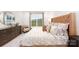 Serene main bedroom showcasing a large window, dresser with decor, and a comfortable bed at 4240 Steel Way, Sherrills Ford, NC 28673