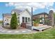 Beautifully landscaped backyard featuring a deck with a pergola, fireplace, hot tub, and mature trees at 500 Chicory Cir, Matthews, NC 28104