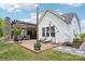 Spacious backyard with a large deck, outdoor kitchen, dining area, and lush green lawn at 500 Chicory Cir, Matthews, NC 28104