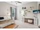 Bright bedroom with window, shelving, desk, and ceiling fan offers a cozy and functional space at 500 Chicory Cir, Matthews, NC 28104