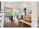 Open dining room featuring modern lighting, hardwood floors, and an adjacent living area at 500 Chicory Cir, Matthews, NC 28104