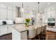 Bright kitchen featuring granite countertops, stainless steel appliances, and pendant lighting at 500 Chicory Cir, Matthews, NC 28104