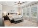 The main bedroom features a tray ceiling, neutral decor and large windows at 500 Chicory Cir, Matthews, NC 28104