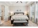 The main bedroom offers a trey ceiling, soft carpet and natural light from large windows at 500 Chicory Cir, Matthews, NC 28104
