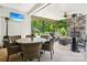 Inviting outdoor patio with comfortable seating, a fireplace, and a large TV at 500 Chicory Cir, Matthews, NC 28104