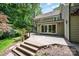 Multi-level deck with steps, glass sliding doors to the house, and a well-maintained backyard at 5206 Morrowick Rd, Charlotte, NC 28226