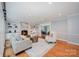 Spacious living room showcases a fireplace, comfortable seating, and bright lighting at 5206 Morrowick Rd, Charlotte, NC 28226