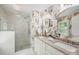 The main bathroom features dual sinks, a glass enclosed shower, and elegant floral wallpaper at 5206 Morrowick Rd, Charlotte, NC 28226