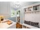 Functional mudroom with built-in storage, bench seating, and convenient access to the stairs at 5206 Morrowick Rd, Charlotte, NC 28226