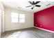 Comfortable bedroom featuring a modern ceiling fan, wood-look floors, and natural light at 5310 Waverly Lynn Ln, Charlotte, NC 28269