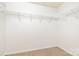 Walk-in closet provides shelving and carpeted floors at 5310 Waverly Lynn Ln, Charlotte, NC 28269