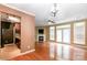 Open-concept living room with fireplace, French doors, and seamless flow to the kitchen at 5310 Waverly Lynn Ln, Charlotte, NC 28269