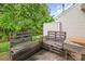 Inviting patio features built-in wooden benches, perfect for outdoor relaxation and enjoying the surrounding greenery at 5310 Waverly Lynn Ln, Charlotte, NC 28269