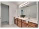 Bathroom with a double sink vanity, a large mirror, and an adjacent room at 605 Summey Farm Dr, Dallas, NC 28034