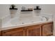 A relaxing bathtub featuring a dark wooden cabinet base and sleek faucet at 605 Summey Farm Dr, Dallas, NC 28034