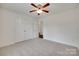 This bedroom has neutral walls, carpet, and a closet at 605 Summey Farm Dr, Dallas, NC 28034