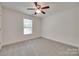 Bedroom with neutral carpet, a ceiling fan, and a single window with blinds at 605 Summey Farm Dr, Dallas, NC 28034