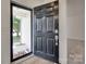 Close up of front door with storm door, dark wood door, and visible exterior view at 605 Summey Farm Dr, Dallas, NC 28034