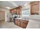 Spacious kitchen featuring stainless steel appliances, tile flooring, and ample counter space at 605 Summey Farm Dr, Dallas, NC 28034