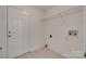 The laundry room features tile floors and shelving at 605 Summey Farm Dr, Dallas, NC 28034