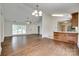 Open living space with hardwood flooring, high ceilings, and plenty of natural light at 605 Summey Farm Dr, Dallas, NC 28034