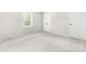 Clean bedroom with window, neutral walls, carpet, and closet at 616 Silversmith Ln, Charlotte, NC 28270