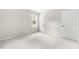 Neutral bedroom with soft carpet, a window, and two doors at 616 Silversmith Ln, Charlotte, NC 28270