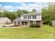 Charming two-story home featuring a brick facade, vinyl siding, and a well-maintained front lawn at 616 Silversmith Ln, Charlotte, NC 28270