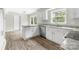 Updated kitchen with granite countertops, stainless steel appliances, and new cabinets and luxury vinyl flooring at 616 Silversmith Ln, Charlotte, NC 28270