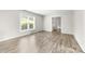 Bright living room with wood floors and a large window at 616 Silversmith Ln, Charlotte, NC 28270