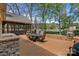 The spacious deck is perfect for outdoor entertaining, complete with a table and an umbrella at 6202 Providence Country Club Dr, Charlotte, NC 28277