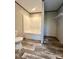 Bathroom features a bathtub and shower and wooden floors at 796 Old Wilkesboro Rd, Taylorsville, NC 28681