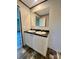 Bathroom features a double sink vanity, wooden floors, and large mirror at 796 Old Wilkesboro Rd, Taylorsville, NC 28681