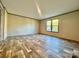 Bright bedroom featuring wood-look floors, neutral walls, and natural light at 796 Old Wilkesboro Rd, Taylorsville, NC 28681