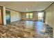 Spacious living room with wood-look floors and natural light at 796 Old Wilkesboro Rd, Taylorsville, NC 28681