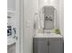 Modern half-bathroom with gray vanity, decorative mirror, and stylish decor at 980 Bunker Trce, Rock Hill, SC 29730