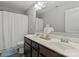 Bright bathroom featuring a double vanity, granite countertop, and shower-tub combo at 980 Bunker Trce, Rock Hill, SC 29730