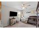 Bedroom bedroom showcases a chair, crib, mounted TV, and cute decorations at 980 Bunker Trce, Rock Hill, SC 29730