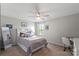 Cozy bedroom featuring neutral walls, a ceiling fan, and a comfortable bed with decorative pillows at 980 Bunker Trce, Rock Hill, SC 29730