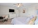 Well-lit bedroom with desk, large bed, TV, and dresser at 980 Bunker Trce, Rock Hill, SC 29730