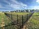 Community dog park surrounded by black fencing with neighborhood homes in the background at 980 Bunker Trce, Rock Hill, SC 29730