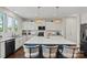 Spacious kitchen features a large island, white cabinets, and stainless steel appliances at 980 Bunker Trce, Rock Hill, SC 29730