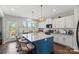 Bright kitchen featuring a large island with seating, white cabinets, and modern appliances at 980 Bunker Trce, Rock Hill, SC 29730