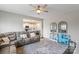 Cozy living room with comfortable seating, neutral rug, and view of the open-concept kitchen at 980 Bunker Trce, Rock Hill, SC 29730