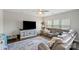Comfortable living room with plush sectional, ceiling fan, television, and neutral-toned decor at 980 Bunker Trce, Rock Hill, SC 29730