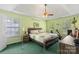 Serene bedroom with a tray ceiling, windows for natural light, and cozy decor at 101 Canopy Ct, Mooresville, NC 28115