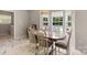 Bright dining area with backyard views and modern decor at 101 Canopy Ct, Mooresville, NC 28115