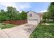 Driveway leading up to a two-car garage and a fenced backyard at 101 Canopy Ct, Mooresville, NC 28115