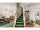 Inviting entryway with staircase, chandelier, and dining area adjacent at 101 Canopy Ct, Mooresville, NC 28115